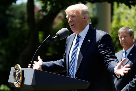 U.S. President Donald Trump presents the U.S. Air Force Academy football team with the Commander-in-Chief trophy in the Rose Garden of the White House in Washington, U.S., May 2, 2017. REUTERS/Joshua Roberts