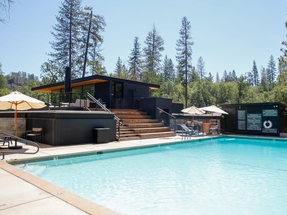 an empty pool next to the clubhouse