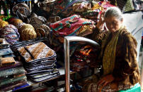 Every day is slow day: A senior batik vendor waiting for buyers near her stall. Batik is not only clothing, it could also be applied to a variety of craft items. (