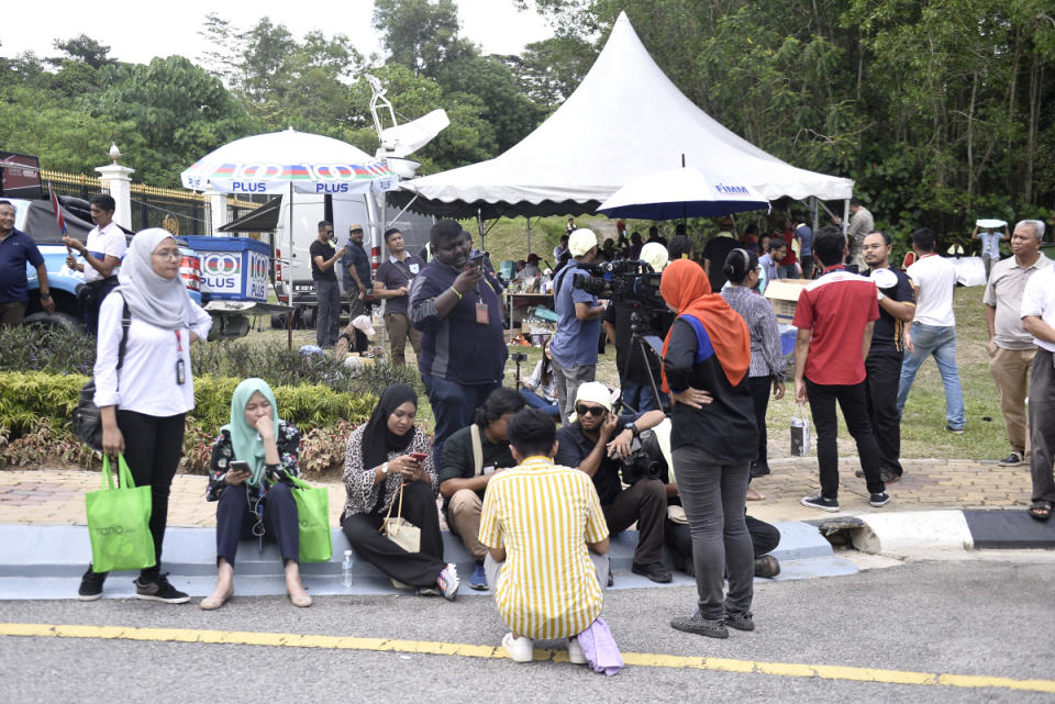 Members of the media gather in front of Istana Negara February 26, 2020. — Picture by Miera Zulyana