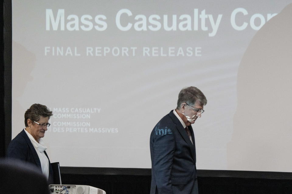 Commissioners Michael MacDonald, right, chair, and Leanne Fitch arrive to deliver the final report of the Mass Casualty Commission inquiry into the mass murders in rural Nova Scotia in Truro, Nova Scotia, Thursday, March 30, 2023. (Darren Calabrese/The Canadian Press via AP)