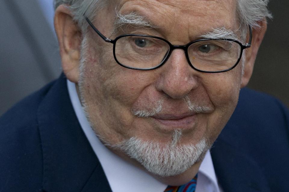 Veteran entertainer Rolf Harris arrives at Southwark Crown Court in London, Tuesday, May 6, 2014. Harris is charged with nine counts of indecent assault and four counts of making indecent images of children. (AP Photo/Matt Dunham)