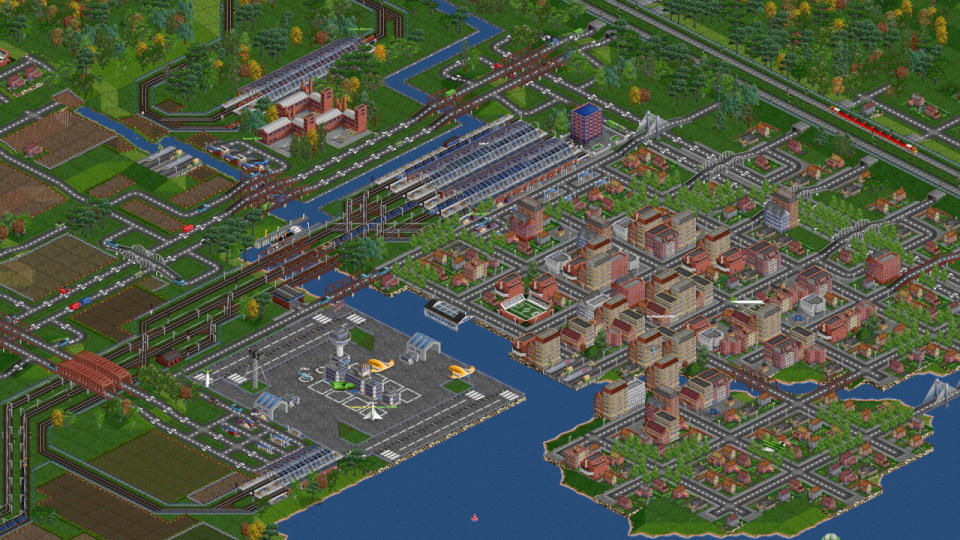Best Free Steam Games - An image from transport game OpenTTD of trains and a village