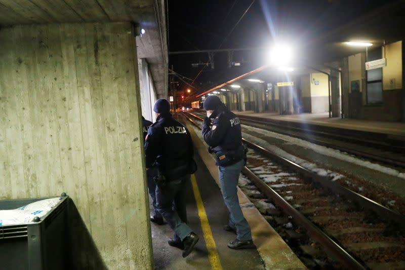 Italian police officers are seen at the Brennero-Brenner train station in Italy