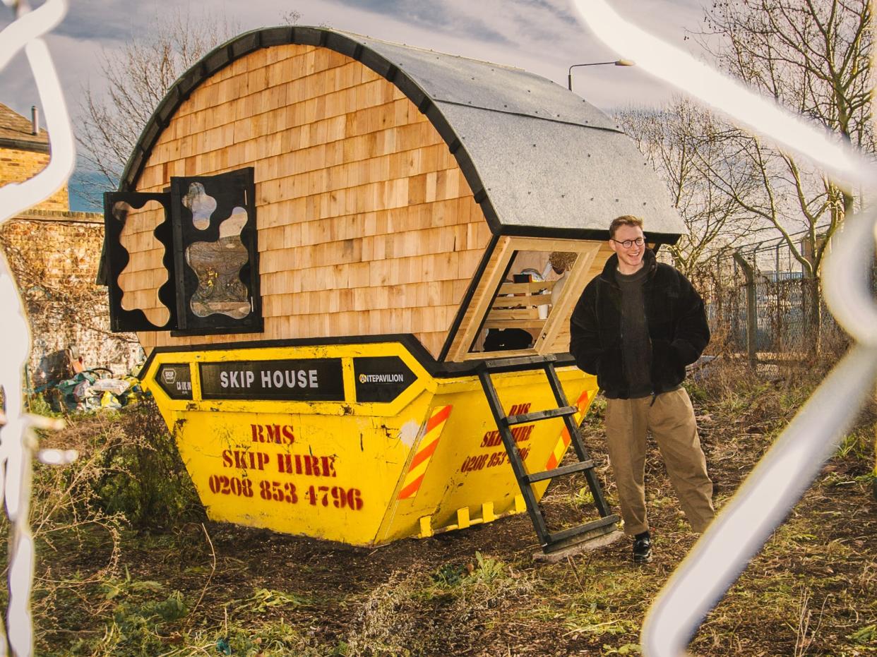 Outside the tiny dumpster home