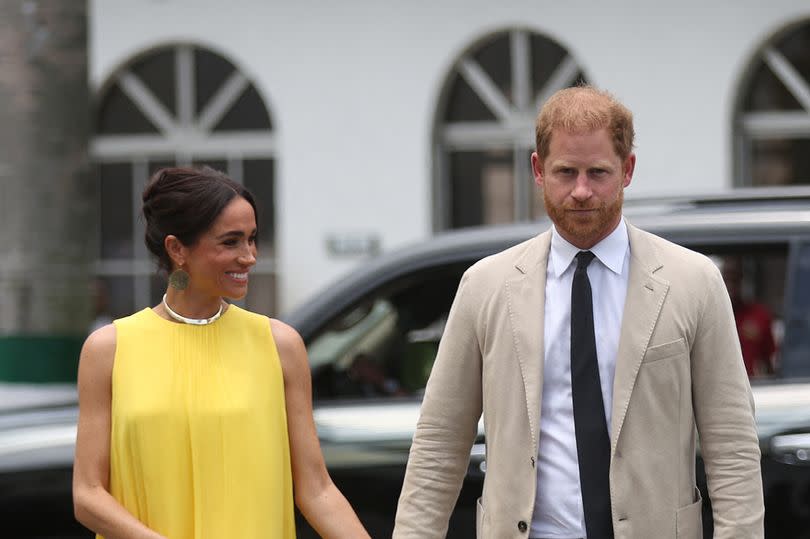 Britain's Meghan (L), Duchess of Sussex, and Britain's Prince Harry (R), Duke of Sussex arrive at the State Governor House in Lagos on May 12, 2024 as they visit Nigeria as part of celebrations of Invictus Games anniversary. (Photo by Kola SULAIMON / AFP) (Photo by KOLA SULAIMON/AFP via Getty Images)