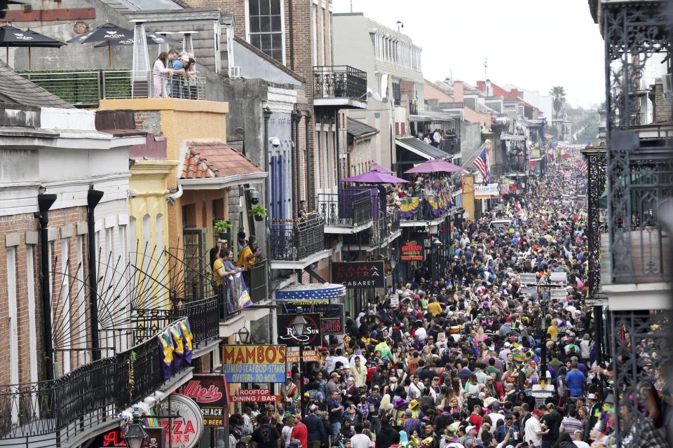 In this Feb. 25, 2020, file photo, Bourbon Street is a sea of humanity on Mardi Gras day in New Orleans.