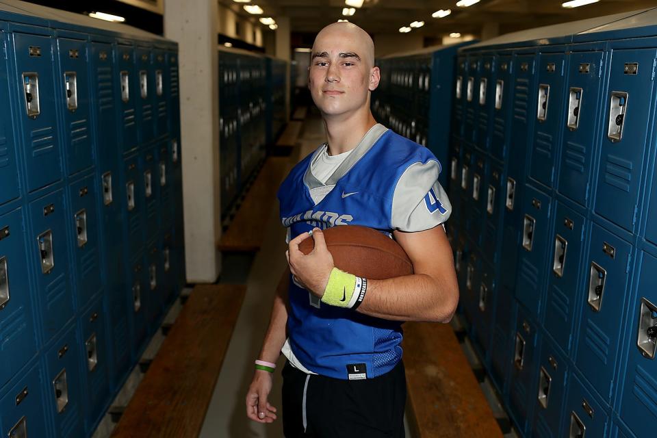 Braintree High quarterback James Tellier stands in the locker room at Braintree High before football practice at Braintree High School on Tuesday, Sept. 6, 2022.