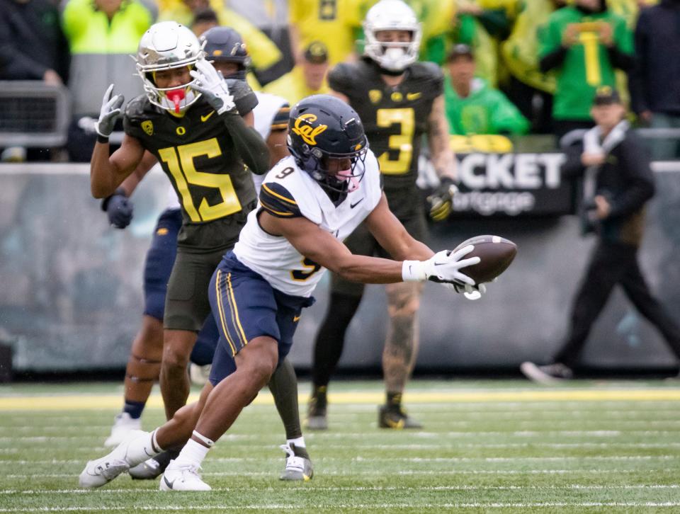 Cal's Patrick McMorris intercepts a pass against Oregon.