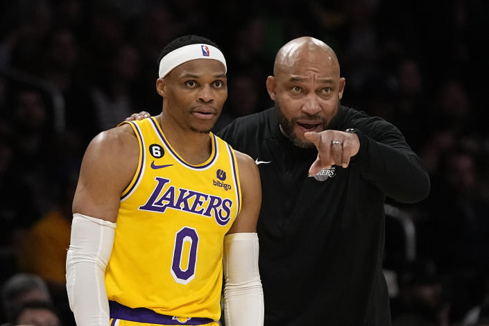 Los Angeles Lakers head coach Darvin Ham, right, talks with guard Russell Westbrook during their NBA game against the Portland Trail Blazers in Los Angeles on Nov. 30, 2022. (AP Photo/Mark J. Terrill)