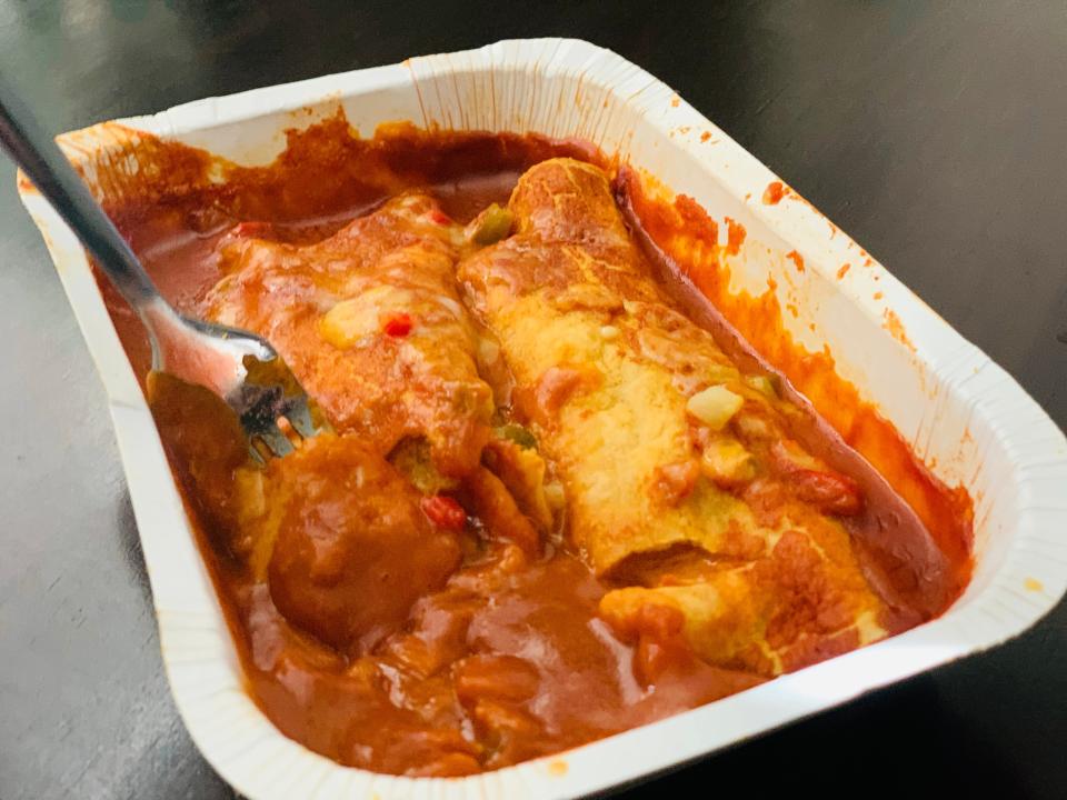 Trader Joe's cheese enchiladas cooked in white microwaveable container