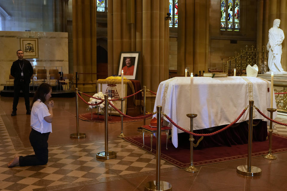 The coffin of Cardinal George Pell lays in state at St. Mary's Cathedral in Sydney, Wednesday, Feb. 1, 2023. Mourners paid their respects to Cardinal George Pell who lay in state in a Sydney cathedral on Wednesday as police sought a court order to prevent protesters from disrupting his funeral. (AP Photo/Rick Rycroft, Pool)