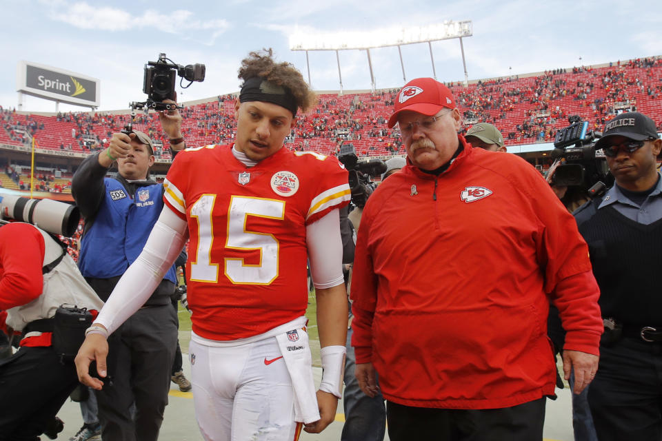 Chiefs quarterback Patrick Mahomes (15) walks off the field with head coach Andy Reid after Sunday’s game in Kansas City. (AP)