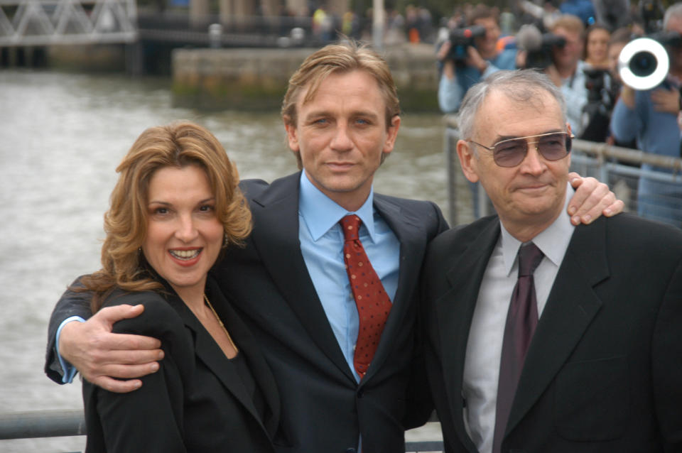 Actor Daniel Craig (centre), being presented to the press  at St Catharines's dock as the new James Bond alongside producers Barbara Boccoli, Michael G Wilson, London, 14 October 2005. (Photo by Phil Dent/Redferns)