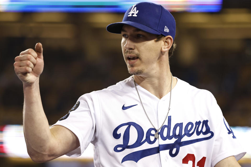 LOS ANGELES, CALIFORNIA - MAY 28: Walker Buehler #21 of the Los Angeles Dodgers fist bumps Yoshi Tsutsugo #28 of the Los Angeles Dodgers after closing out against the San Francisco Giants during the sixth inning at Dodger Stadium on May 28, 2021 in Los Angeles, California. (Photo by Michael Owens/Getty Images)