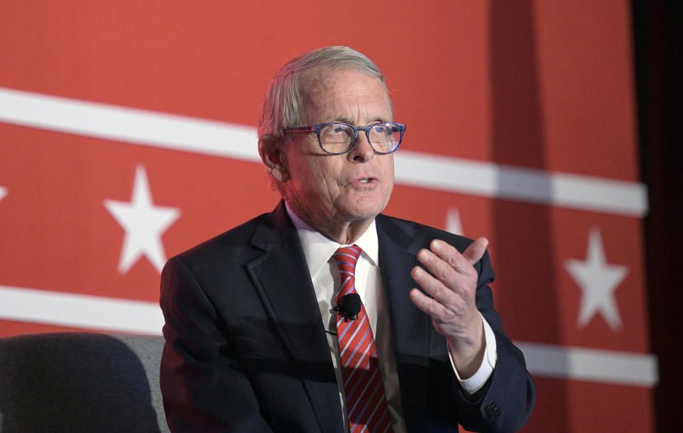 FILE - Ohio Gov. Mike DeWine answers a question while taking part in a panel discussion during a Republican Governors Association conference, Nov. 16, 2022, in Orlando, Fla. An Associated Press review finds that gambling interests positioning for lucrative business in Ohio's developing betting landscape gave nearly $1 million to a nonprofit that helped DeWine get reelected. (AP Photo/Phelan M. Ebenhack, File)