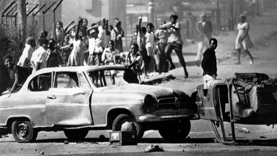 Cars are used as roadblocks on June 21, 1976, during unrest in Soweto, South Africa, stemming from protests against the use of Afrikaans in schools. - Keystone/Hulton Archive/Getty Images