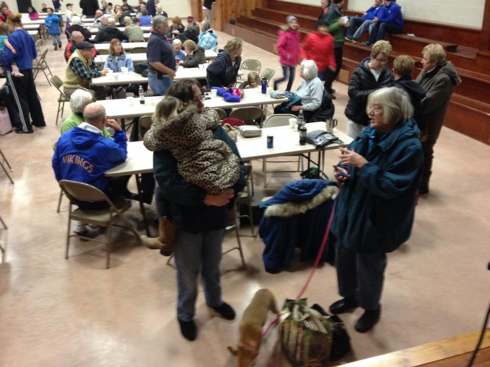 Residents of Northwood, Iowa care centers are evacuated Thursday morning, Feb. 20, 2014 to the Kensett Community Center, about six miles away, following a chemical fire at a fertilizer plant in Northwood. Sulfuric acid for fertilizer is on fire at a storage facility at the Northwood airport. Northwood has a population of about 2,000 people. (AP Photo/The Globe-Gazette, Jeff Heinz)