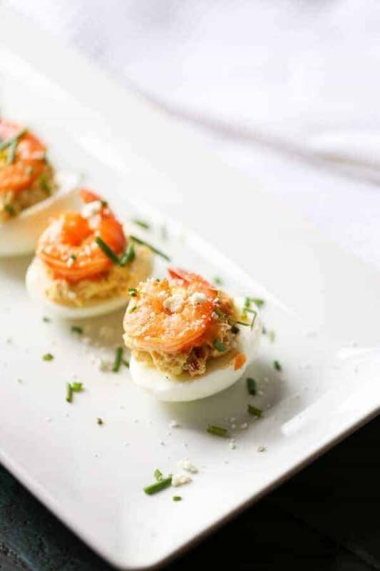 <p>Lemons For Lulu</p><p>Forget what you know about deviled eggs! These deviled eggs have a real kick! Spicy buffalo shrimp rests atop a tangy egg for a fun appetizer!</p><p><strong>Get the recipe: <a href="https://www.lemonsforlulu.com/buffalo-shrimp-deviled-eggs/" rel="nofollow noopener" target="_blank" data-ylk="slk:Buffalo Shrimp Deviled Eggs;elm:context_link;itc:0;sec:content-canvas" class="link rapid-noclick-resp">Buffalo Shrimp Deviled Eggs</a></strong></p>