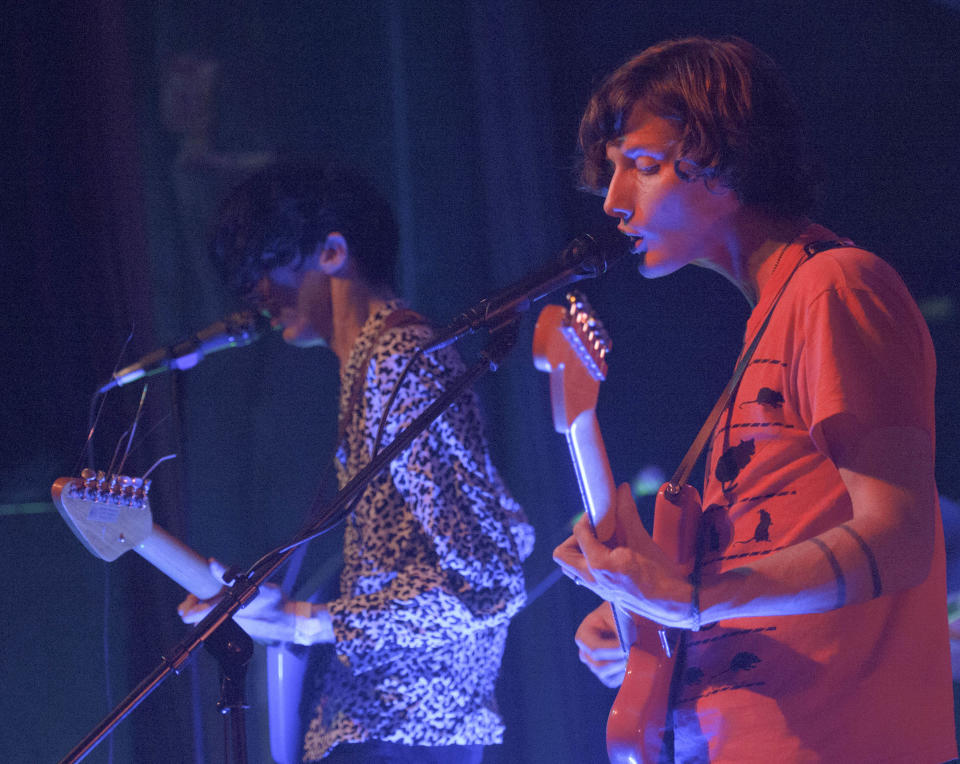 Bradford Cox, left, and Lockett Pundt sing and play guitar along with other members of the indie rock group Deerhunter, at One Eyed Jack's in the French Quarter in New Orleans, Monday, April 29, 2013. (AP Photo/Matthew Hinton)