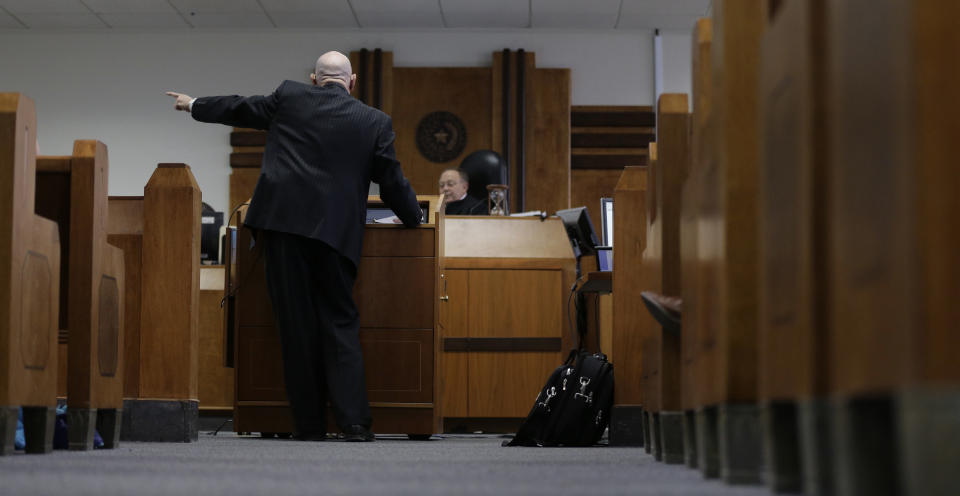 State District Judge John Dietz, right, listens to plaintiff attorney Leonard Schwartz, foreground, closing arguments in the second phase of Texas' school finance trial before , Friday, Feb. 7, 2014, in Austin, Texas. (AP Photo/Eric Gay)