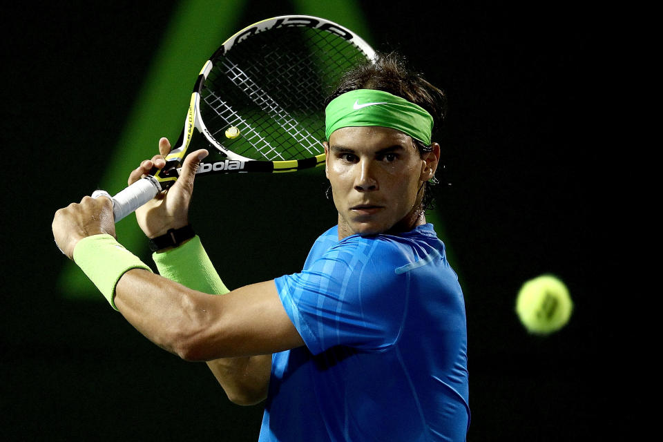 Rafael Nadal of Spain returns a shot to Santiago Giraldo of Columbia during their Sony Ericsson Open match at the Crandon Park Tennis Center, on March 23, in Key Biscayne, Florida. Nadal won 6-2, 6-0. (AFP Photo/Matthew Stockman)