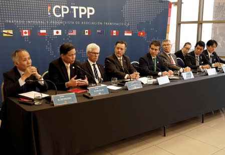 FILE PHOTO: Representatives of the countries members of TPP trade deal, take part in a news conference at the Ministry of Foreign Affairs in Santiago