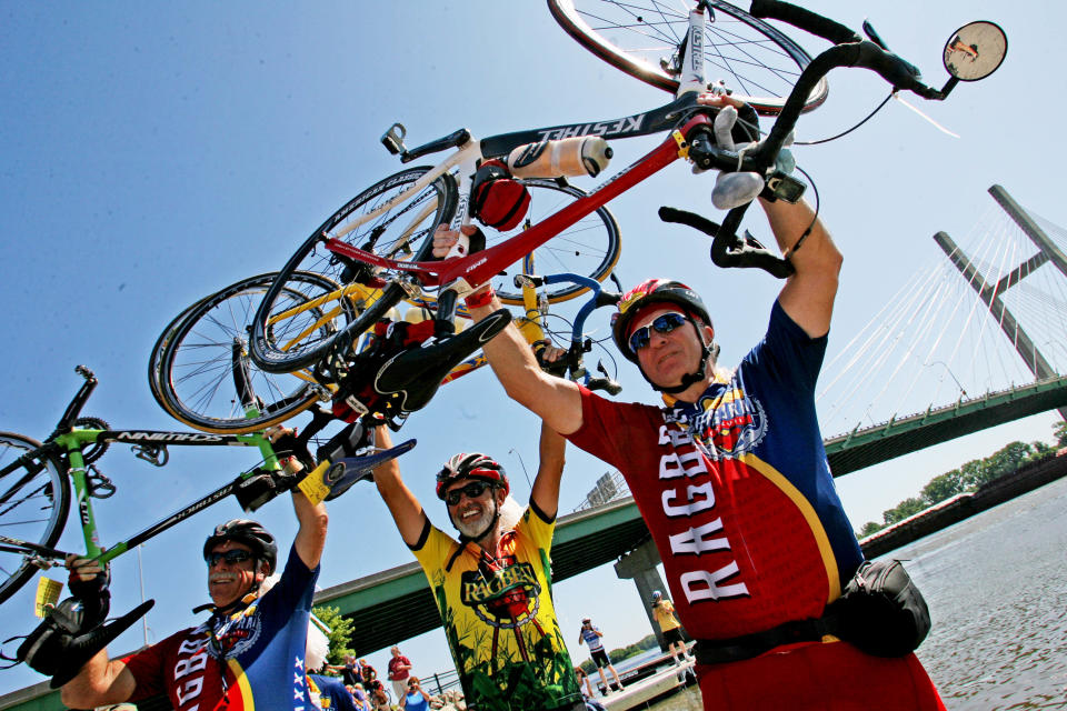 The 2009 ride ended in Burlington, as will RAGBRAI LI. Here, RAGBRAI 2009 day seven riders, including Dick Mellen and Terry Henderson of LaQuinta, California, and Greg Henderson of Jacksonville, Florida, dip their tires in the Mississippi River.