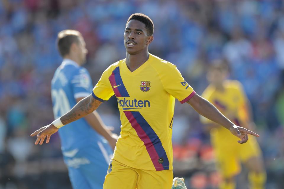 Barcelona's Junior Firpo celebrates after scoring during the Spanish La Liga soccer match between Getafe CF and FC Barcelona in Getafe, outskirts of Madrid, Spain, Saturday, Sept. 28, 2019. (AP Photo/Bernat Armangue)