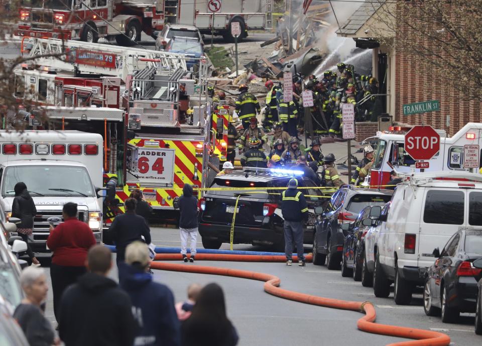 Emergency personnel work at the site of a deadly explosion at a chocolate factory in West Reading, Pa., Friday, March 24, 2023. (Jeff Doelp/Reading Eagle via AP)