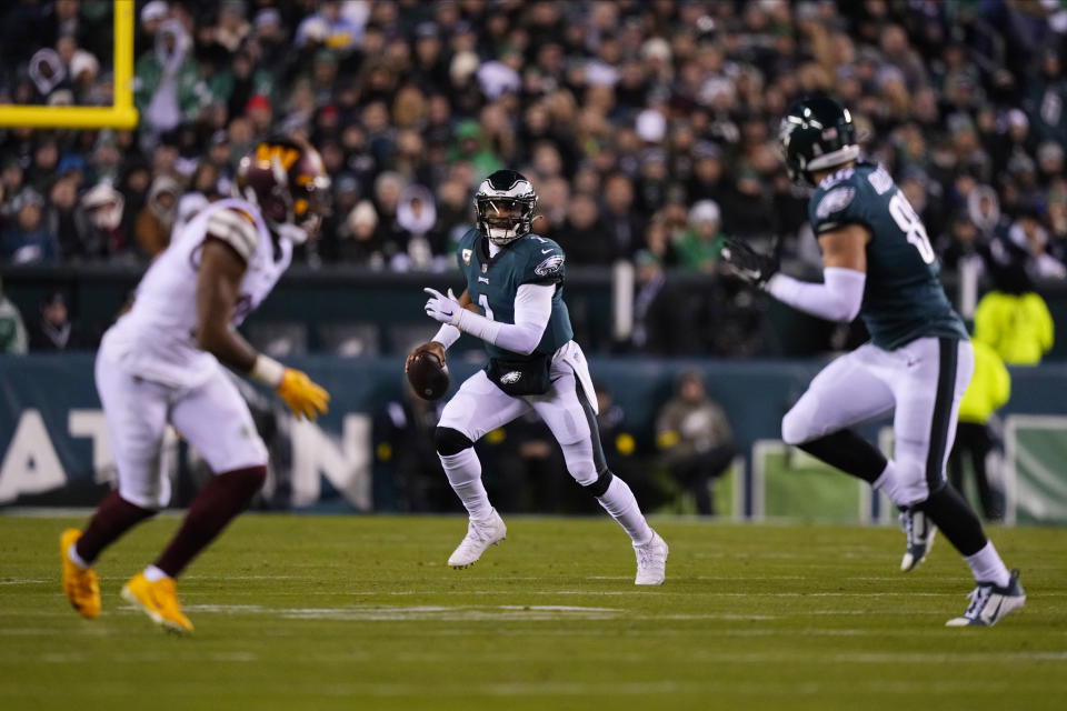 Philadelphia Eagles quarterback Jalen Hurts (1) scrambles during the second half of an NFL football game against the Washington Commanders, Monday, Nov. 14, 2022, in Philadelphia. (AP Photo/Matt Slocum)