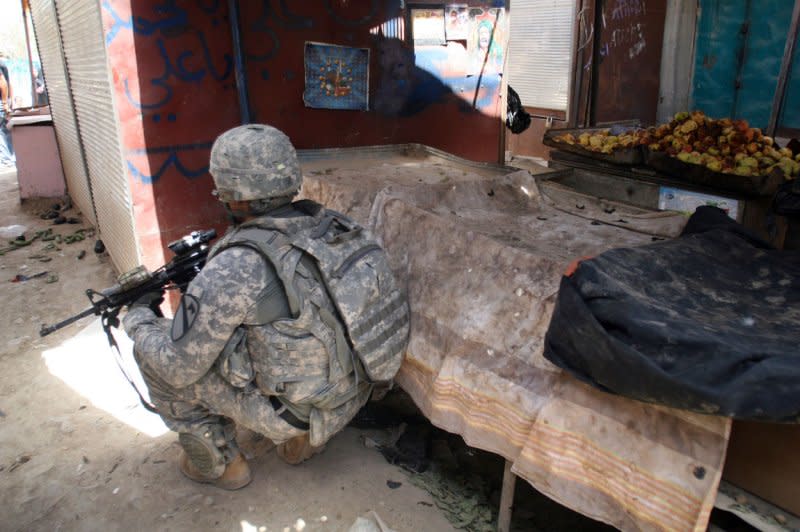 A U.S. soldier inspects the site of a roadside bomb attack in Baghdad, Iraq on June 22, 2009. On August 31, 2010, U.S. President Barack Obama announced the end of the American combat mission in Iraq, seven years after the war began. File Photo by Ali Jasim/UPI