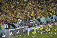 Brazil's players celebrate at the end of the World Cup group G soccer match between Brazil and Switzerland, at the Stadium 974 in Doha, Qatar, Monday, Nov. 28, 2022. (AP Photo/Darko Bandic)