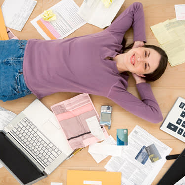 Woman-lying-on-floor-with-office-supplies_web