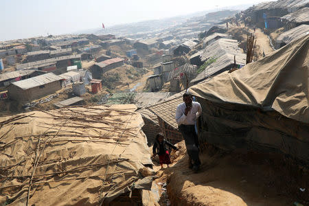 Rohingya refugees walk along the Kutupalong refugee camp in Cox's Bazar, Bangladesh, January 21, 2018. REUTERS/Mohammad Ponir Hossain