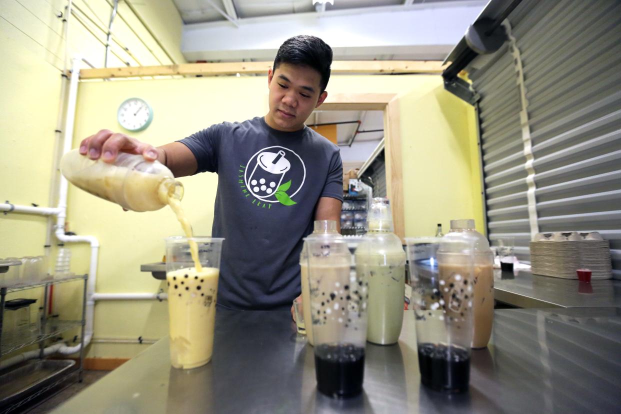 Owner Kevin Nguyen makes a variety of bubble teas at Jasmine Leaf Friday, August 18, 2023, in Appleton, Wis. The tea shop is located at 1804 S. Lawe Street.