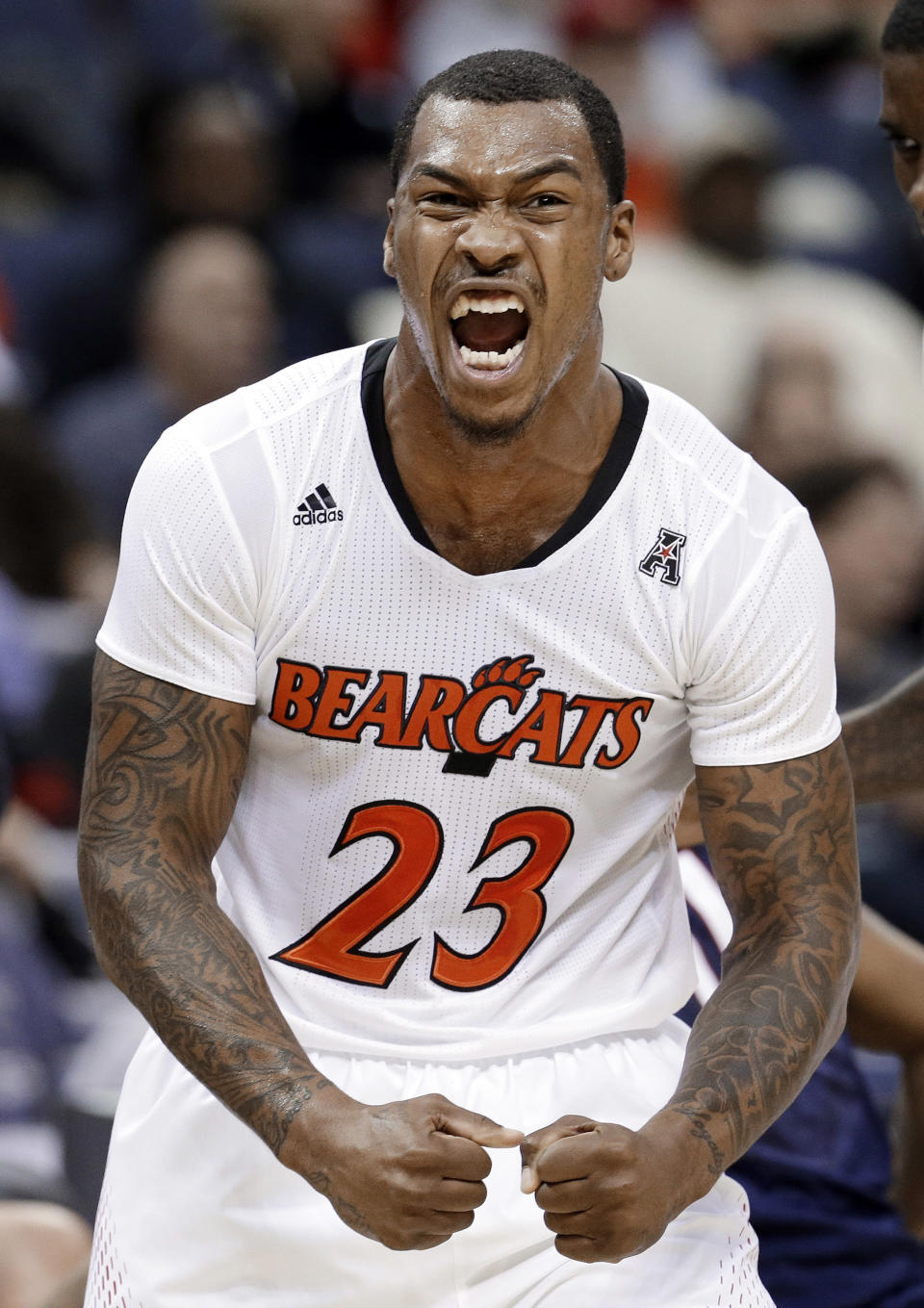 FILE - In this March 14, 2014 file photo, Cincinnati guard Sean Kilpatrick celebrates after scoring against Connecticut during the first half of an NCAA college basketball game in the semifinals of the American Athletic Conference tournament in Memphis, Tenn. Kilpatrick was selected to The Associated Press All-America team, released Monday, March 31, 2014. (AP Photo/Mark Humphrey)