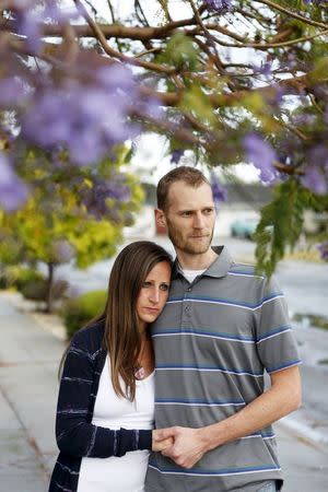 Emily and Matt Knudsen stand outside their home in Fremont, California, May 14, 2015. REUTERS/Beck Diefenbach