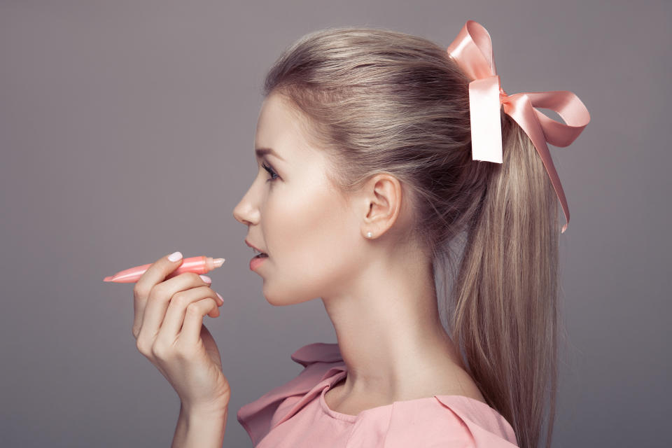 Pretty young woman with lipstick