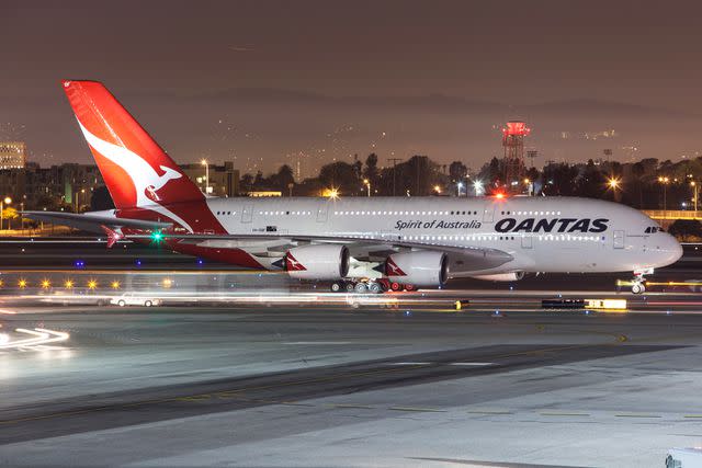 <p>Getty</p> Qantas airplane at Los Angeles International Airport.