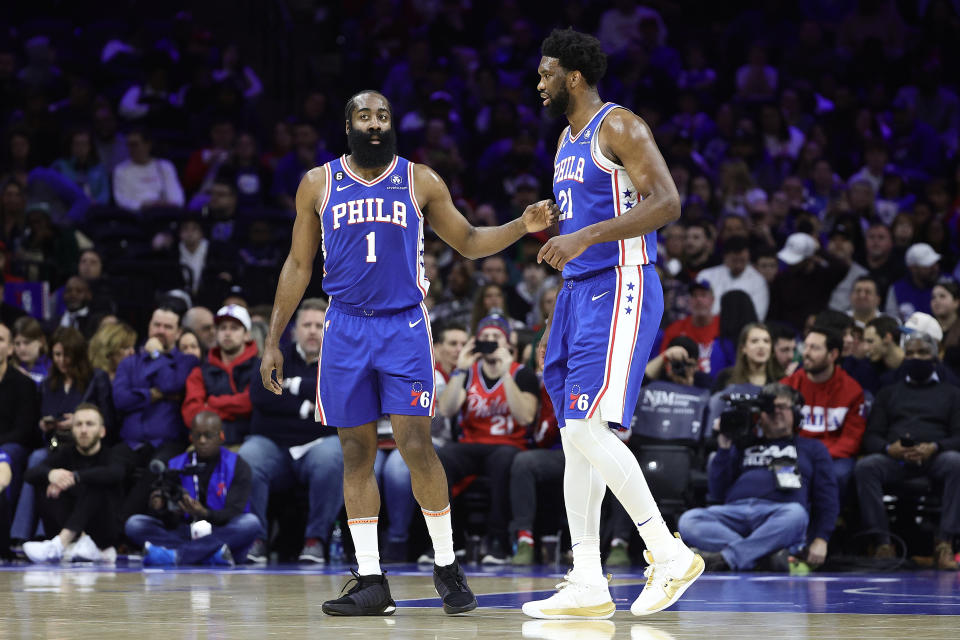 PHILADELPHIA, PENNSYLVANIA - JANUARY 30: James Harden #1 and Joel Embiid #21 of the Philadelphia 76ers speak during the first quarter against the Orlando Magic at Wells Fargo Center on January 30, 2023 in Philadelphia, Pennsylvania. NOTE TO USER: User expressly acknowledges and agrees that, by downloading and or using this photograph, User is consenting to the terms and conditions of the Getty Images License Agreement. (Photo by Tim Nwachukwu/Getty Images)