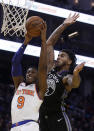 New York Knicks' RJ Barrett (9) shoots against Golden State Warriors' Marquese Chriss, right, in the first half of an NBA basketball game, Wednesday, Dec. 11, 2019, in San Francisco. (AP Photo/Ben Margot)