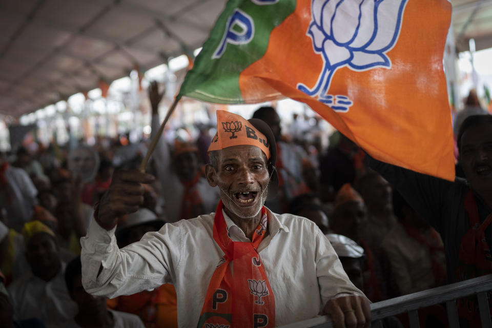 A supporter of India's ruling Bharatiya Janata Party (BJP) cheers during an election rally addressed by Indian Prime Minister Narendra Modi in Meerut, India, Sunday, March 31, 2024. (AP Photo/Altaf Qadri)