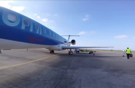 A BMI Regional, Embraer ERJ-145 sits on the tarmac as passengers board in Derry, Northern Ireland May 2, 2017 in this still image taken from social media video. Youtube/Wingin' It! Paul Lucas via REUTERS