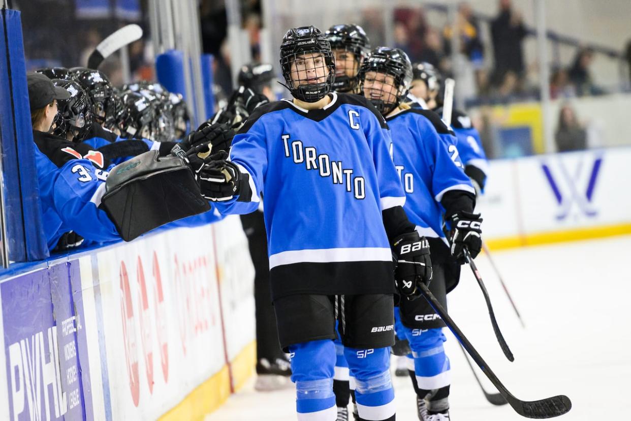 Toronto forward Blayre Turnbull celebrates with teammates after scoring during third period PWHL hockey action against Minnesota in Toronto on Feb. 3. (Christopher Katsarov/The Canadian Press - image credit)