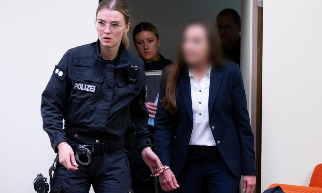<span>A defendant in the case is led into court on Tuesday morning.</span><span>Photograph: Sven Hoppe/Avalon</span>