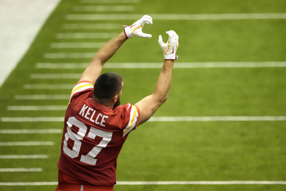 Kansas City Chiefs tight end Travis Kelce stretches during the NFL football team's practice Wednesday, Jan. 24, 2024, in Kansas City, Mo. (AP Photo/Charlie Riedel)