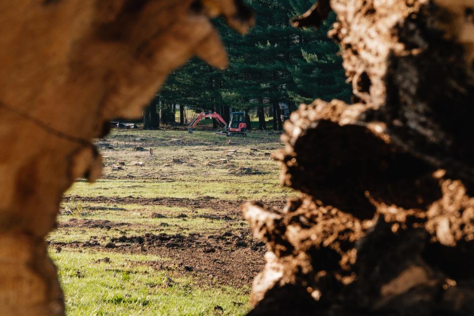 A backhoe sits idle at the site of the planned Crimson Cove housing development, Monday, March 25 along Ohio Ave.