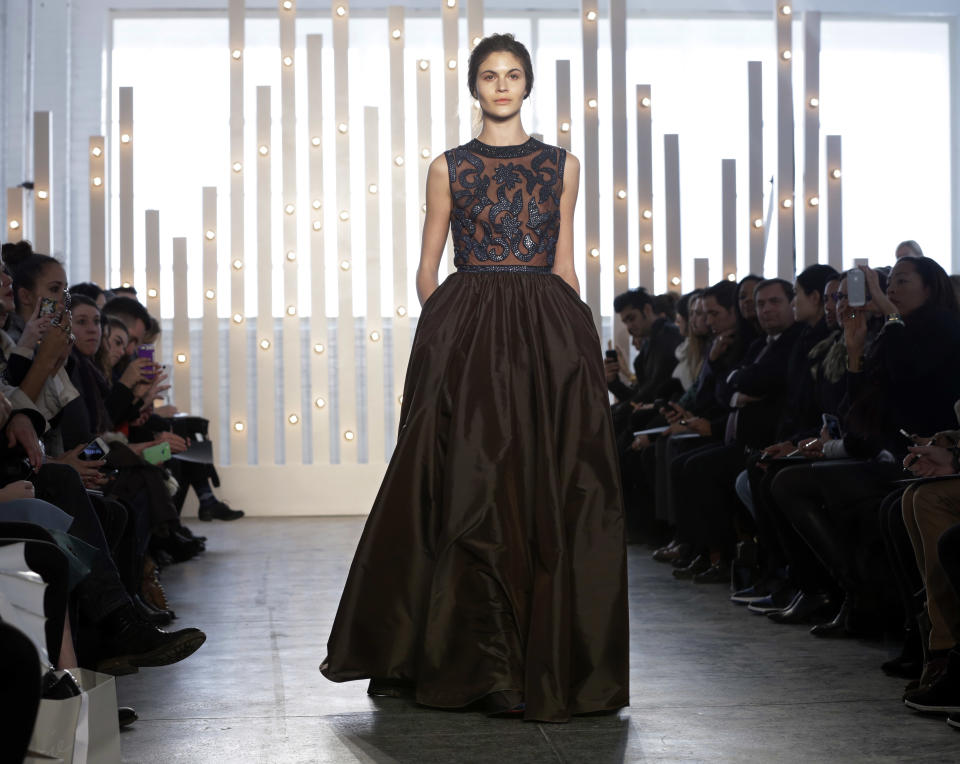 The Jenny Packham Fall 2014 collection is modeled during Fashion Week in New York, Tuesday, Feb. 11, 2014. (AP Photo/Richard Drew)