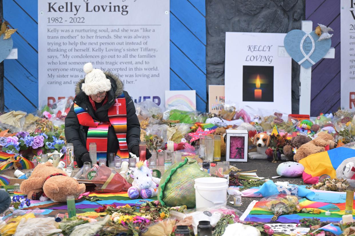 Rev. Jennifer Williamson fix candles at the memorial for the victims of the Club Q shooting in Colorado Springs, Colorado on Tuesday, November 29, 2022.